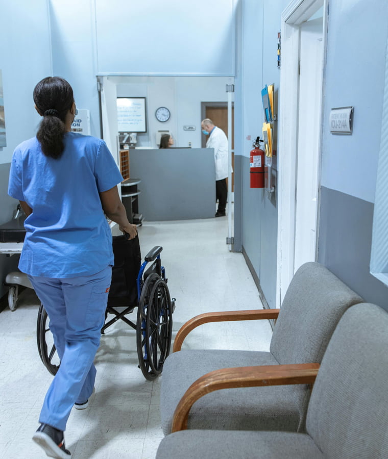 Healthcare facility corridor with commercial doors and durable architectural hardware