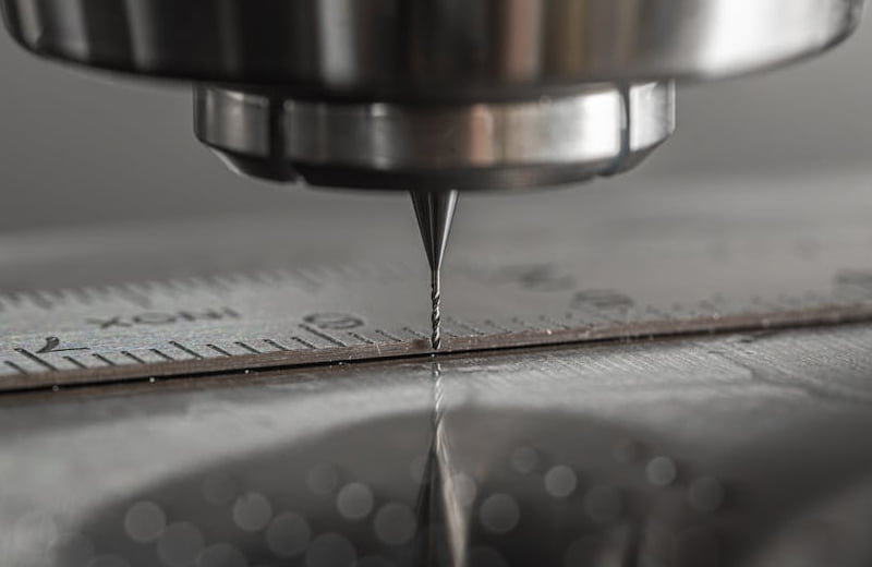 High-precision CNC manufacturing equipment producing architectural hardware components